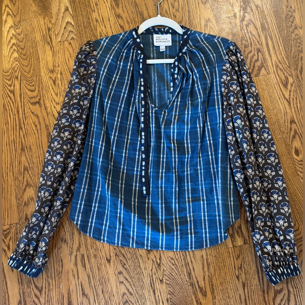 This is a Jo Wolffer Reworked blue plaid and floral print blouse